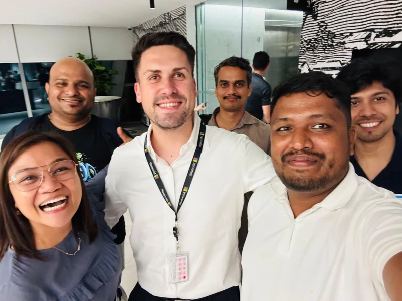 Chandima Galahitiyawa with tech team and colleagues
